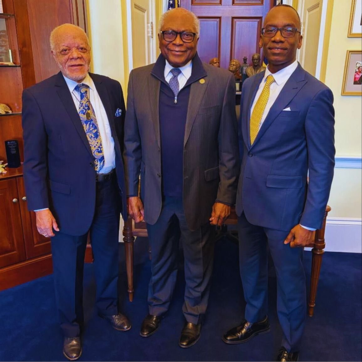 Dr. Michael Thompson standing with two men for a photo.